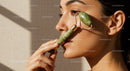 Close-Up of Woman Using Jade Roller for Facial Skin Rejuvenation