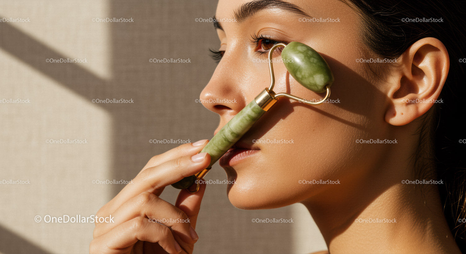 Close-Up of Woman Using Jade Roller for Facial Skin Rejuvenation