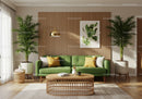 Bright living room with green sofa and natural accents