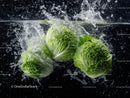 Fresh Green Romanesco Broccoli in Water Splash