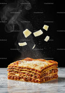Freshly cooked lasagna with falling Parmesan cheese