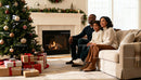 Family enjoying cozy Christmas by the fireplace