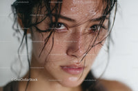 Close-up of Smiling Woman with Wet Hair and Expressive Face