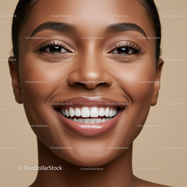 Close up of joyful African woman smiling brightly