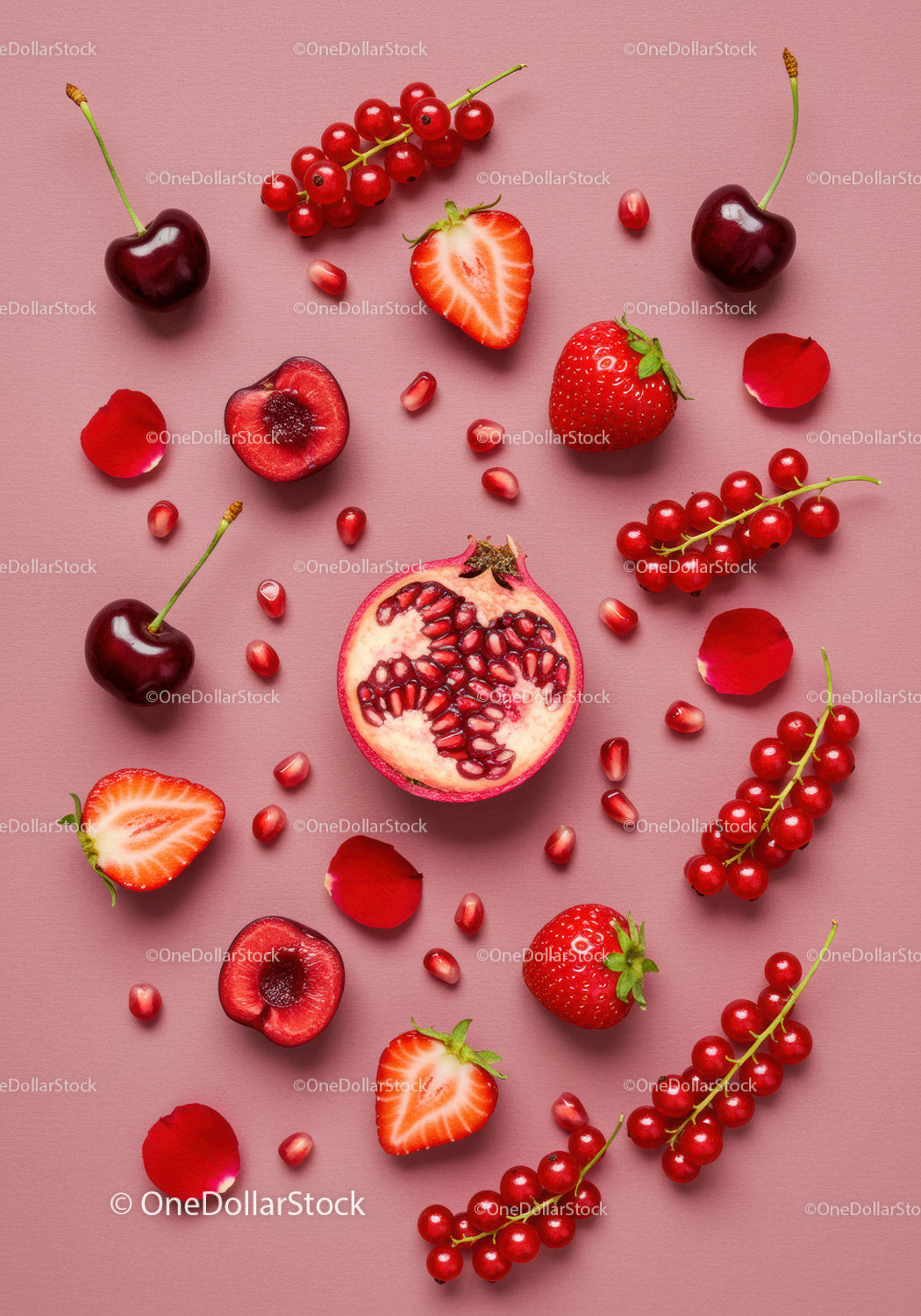Fresh Red Fruits Arrangement on Pink Background