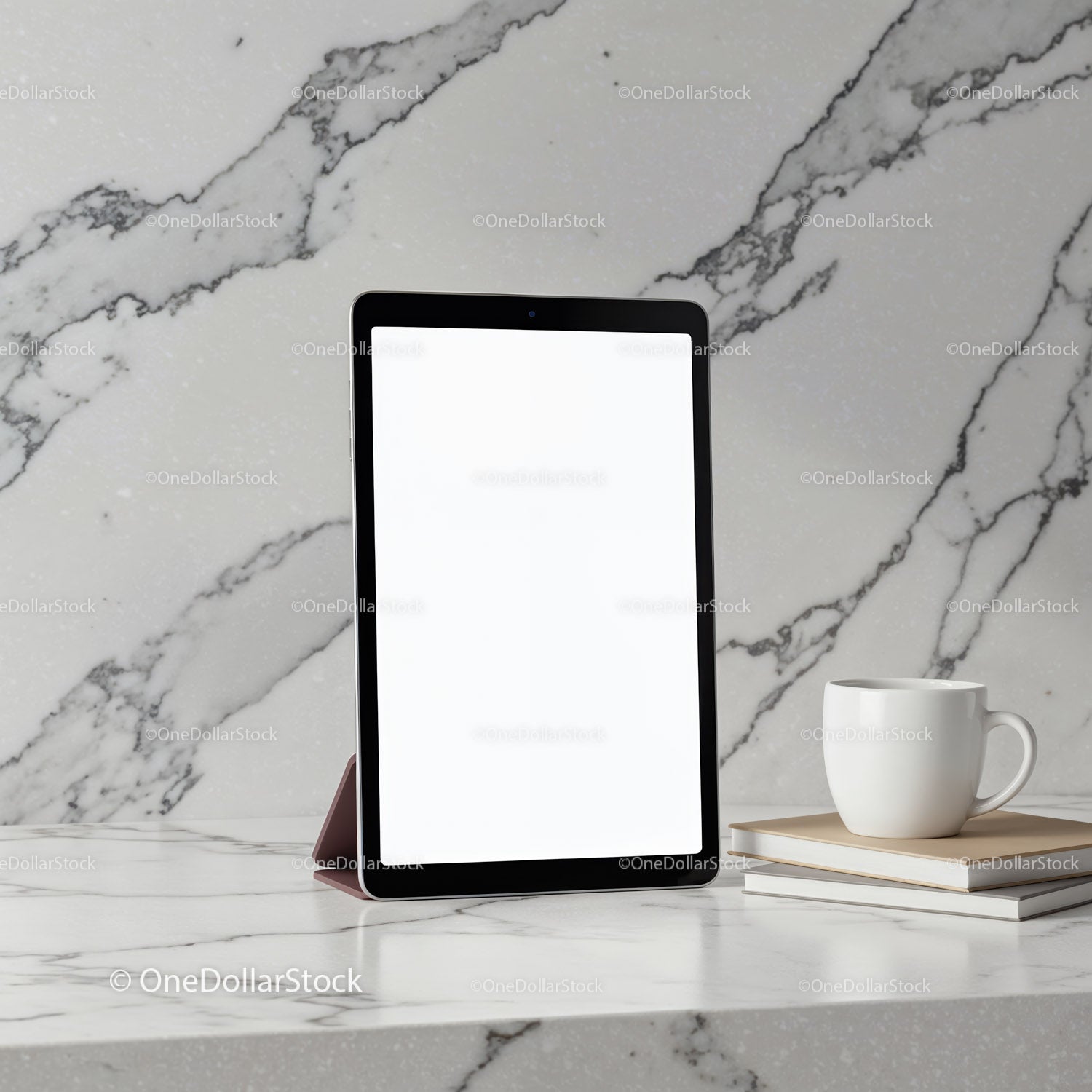 Modern tablet on marble countertop next to coffee cup