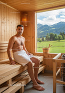 Relaxing Man Sitting in Wooden Sauna with Scenic Mountain View