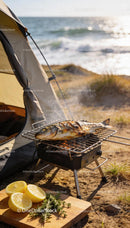 Grilled Fish Cooking on Portable BBQ by the Beach
