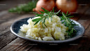 Fresh Garlic Mash with Rosemary Garnish in Rustic Setting