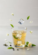 Refreshing iced jasmine tea with fresh blossoms
