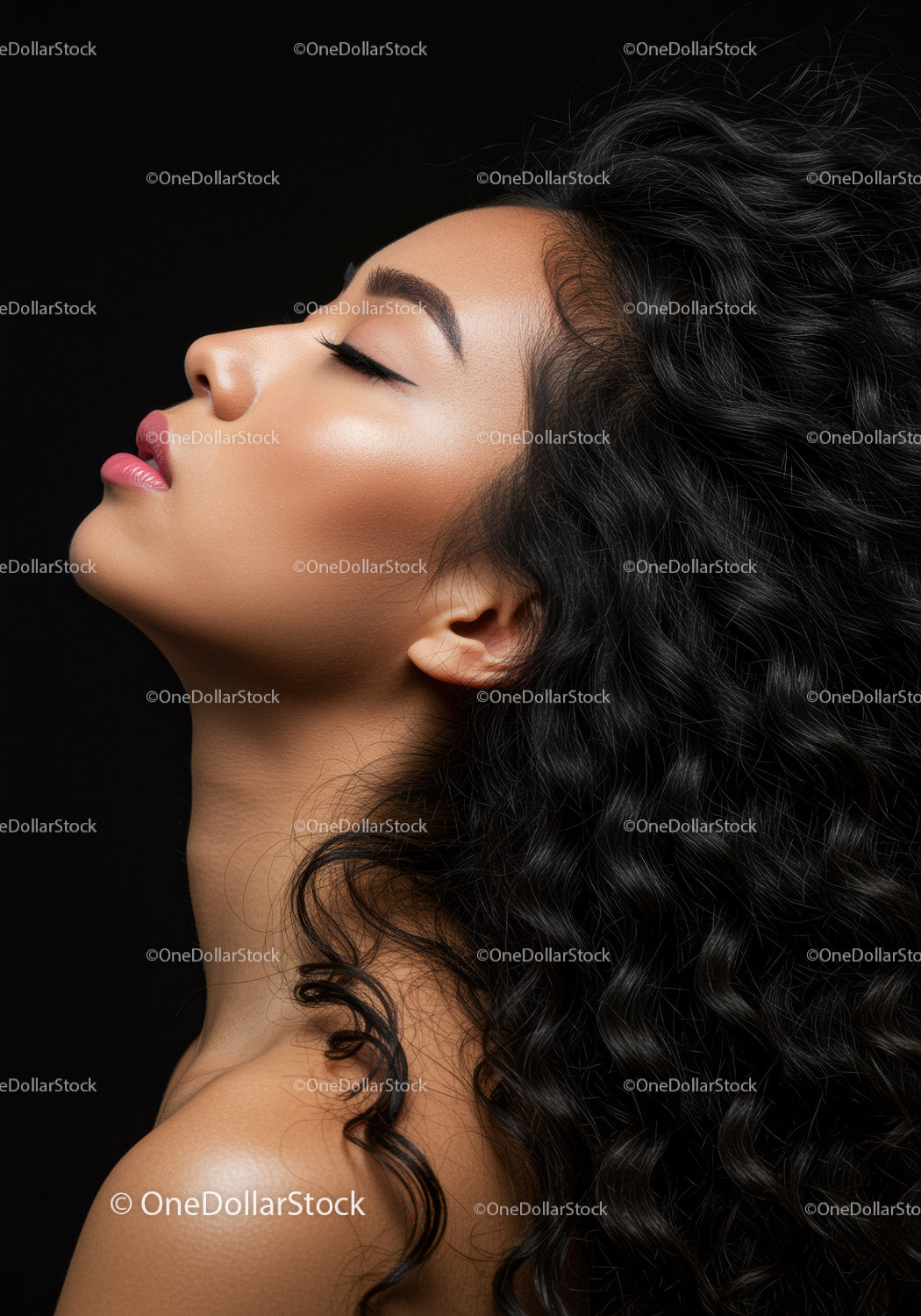Profile of serene woman with flowing curly hair