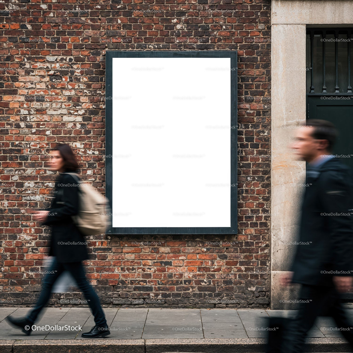 Blank advertising poster on old brick wall in urban street