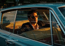 Stylish Man in Sunglasses Driving Vintage Car on Scenic Road