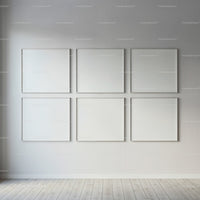 Minimalist gallery wall with six blank white frames