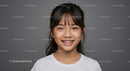 Young Girl Smiling with Braces in Studio Portrait