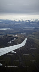 Aerial View of Snow-Capped Mountains and Volcanoes Over Fjords