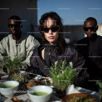 Fashionable Woman in Black Windbreaker and Sunglasses on Rooftop