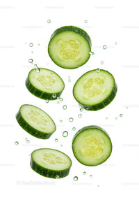 Fresh cucumber slices floating in clear water bubbles