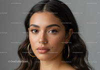 Close-up Portrait of a Beautiful Woman with Brown Eyes and Hoop Earrings
