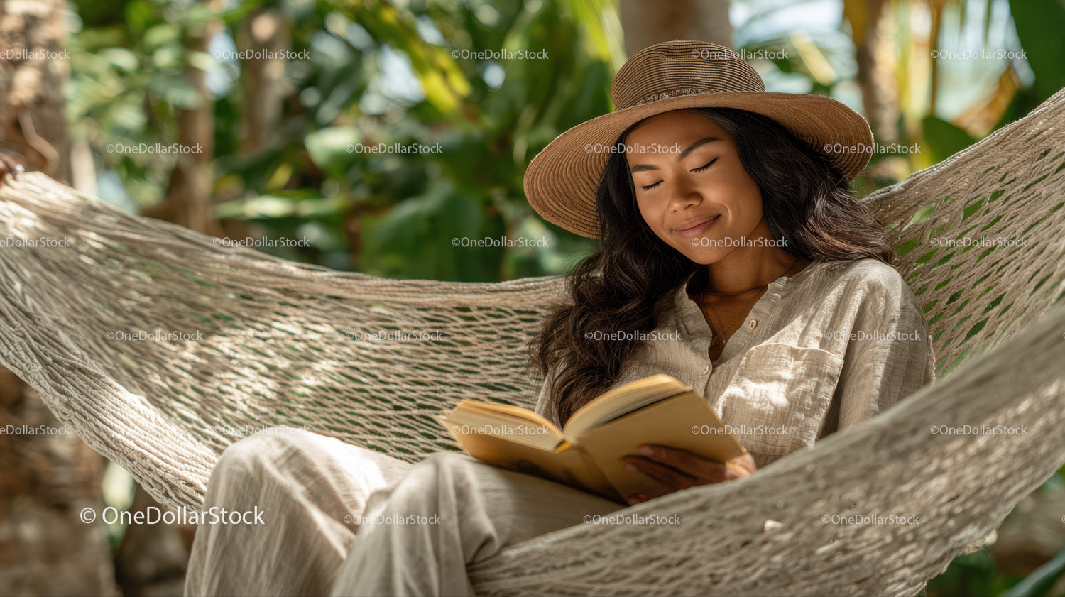 Relaxing Woman Reading in Hammock in Tropical Garden