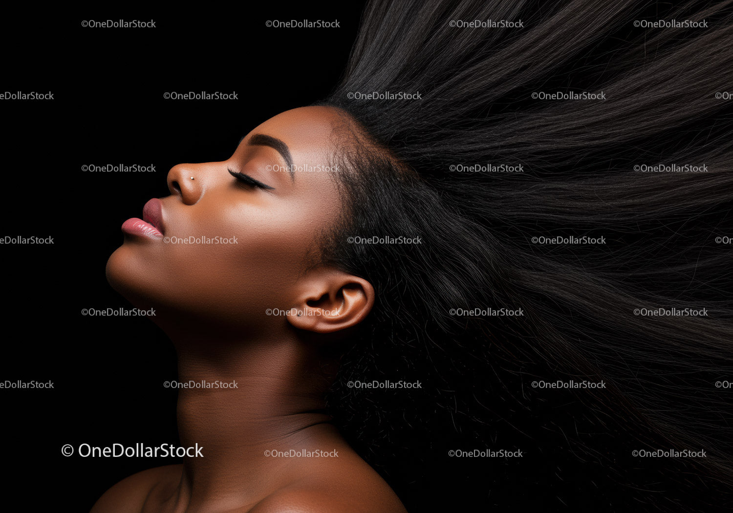 Relaxed woman with flowing hair against black background