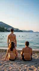 Three Teenagers Relaxing and Swimming at a Sunny Beach Shoreline
