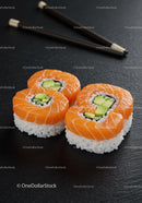 Fresh salmon sushi rolls with avocado and cucumber filling