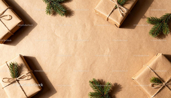 Natural wrapped gifts with pine branches on kraft paper