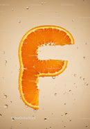 Fresh Orange Slice Shaped Like Letter F in Water