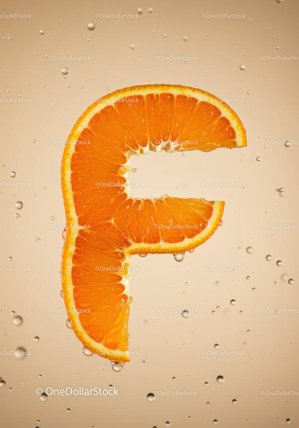 Fresh Orange Slice Shaped Like Letter F in Water