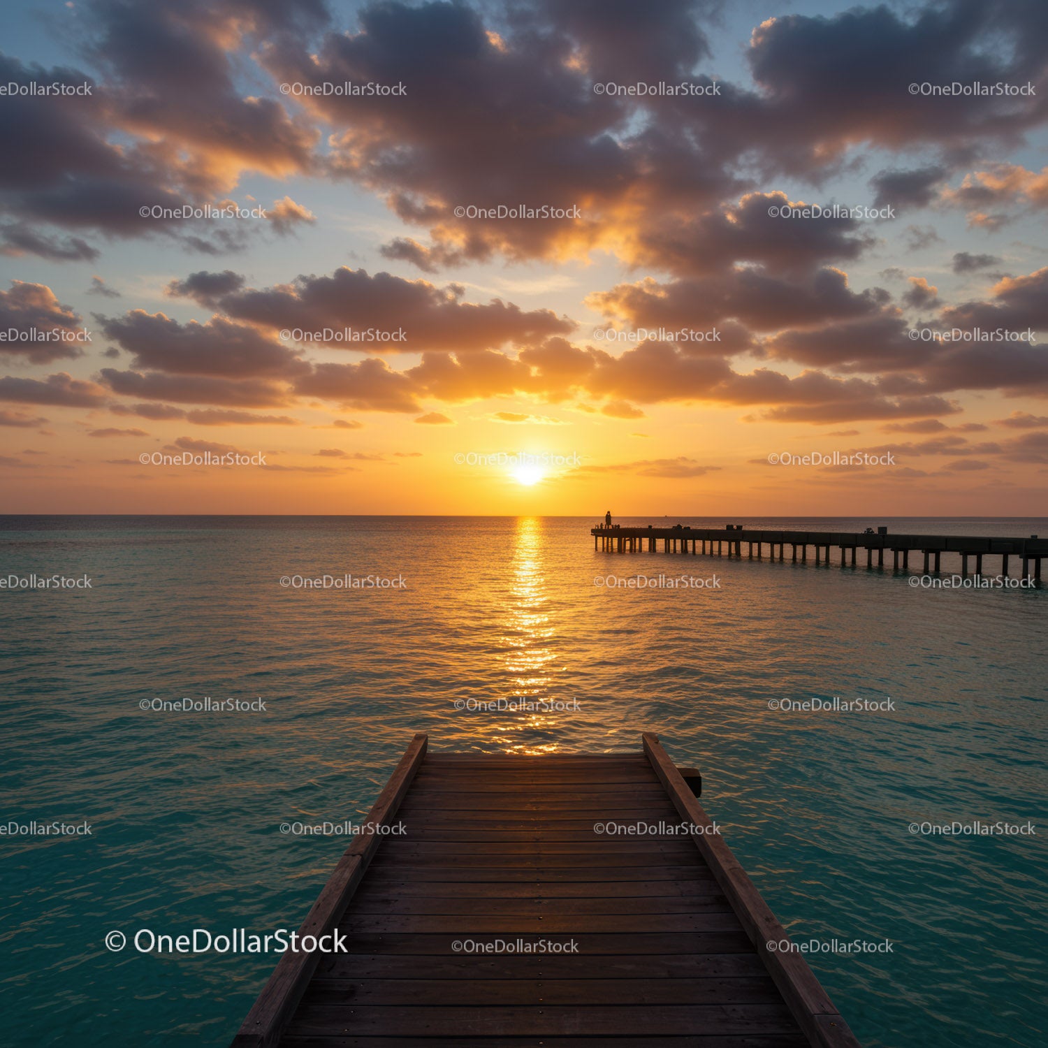 Beautiful Sunset Over Ocean Pier with Vibrant Sky and Calm Water