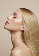 Profile of serene woman with flawless skin and straight blonde hair