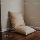 Beige Cushion Resting on Wooden Floor in Cozy Interior Scene