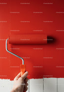 Red Wall Painting with Roller in Modern Interior Renovation