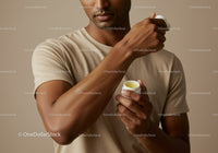 Close-Up of Man Applying Body Lotion for Smooth Skin