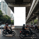 Busy urban street intersection with motorcycles and cars