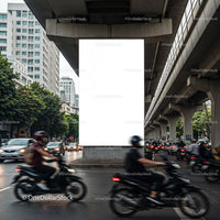 Busy urban street intersection with motorcycles and cars