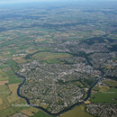 Aerial View of a Town with Green Fields and River