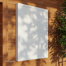 Minimalist white poster on natural wood wall with plant