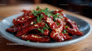 Spicy Red Chili Peppers with Fresh Herbs on a Ceramic Plate