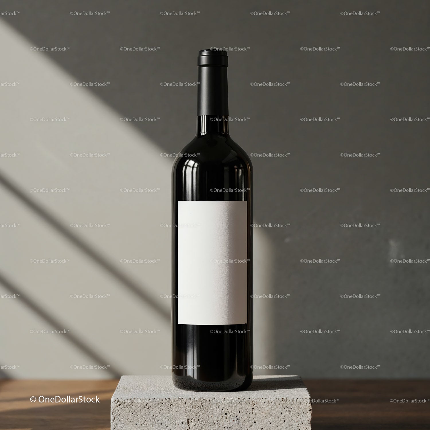 Elegant wine bottle with blank label on stone block
