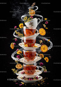 Stack of Tea Cups with Herbal Flowers and Citrus Slices