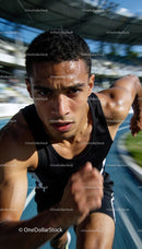 Focused Athlete Sprinting Powerfully on Outdoor Track