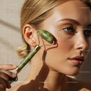 Close-Up of Woman Using Jade Facial Roller for Skin Rejuvenation