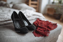 Chic Black Heels and a Red Lace Dress in a Cozy Bedroom Setting