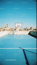 Urban Rooftop Basketball Court with City Skyline View