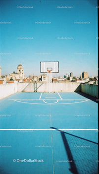 Urban Rooftop Basketball Court with City Skyline View
