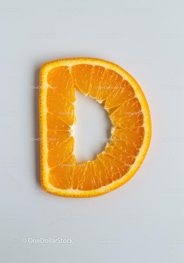 Fresh Orange Slice Shaped Like Letter D on White