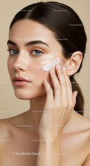 Young Woman Applying Moisturizer to Face for Skincare Routine