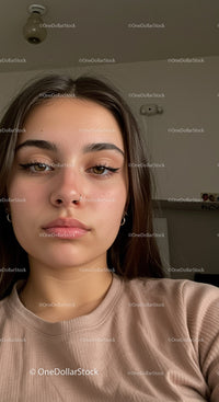Young woman with expressive eyes and natural makeup